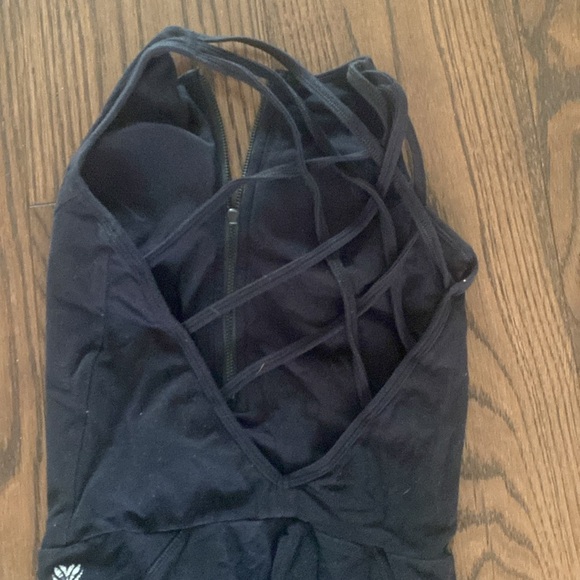 Black cross back jumpsuit with mesh paneling on legs. - Picture 2 of 2